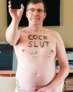 Jonny Goodwin naked with cock slut and other graffiti on his torso