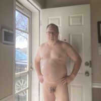 caged faggot in doorway 